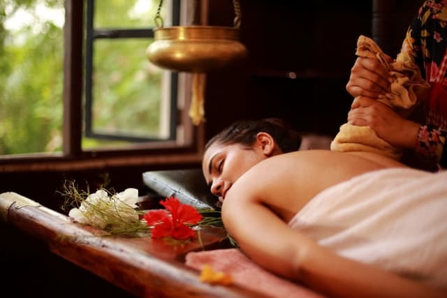 Ayurvedic massage using warm oils for body balance.