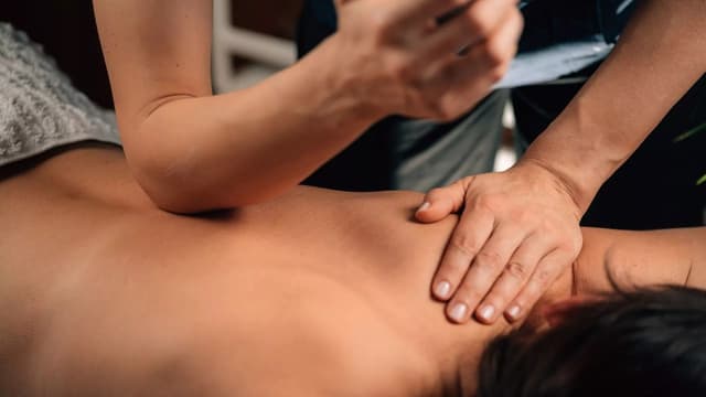 Deep tissue massage focusing on muscle tension.