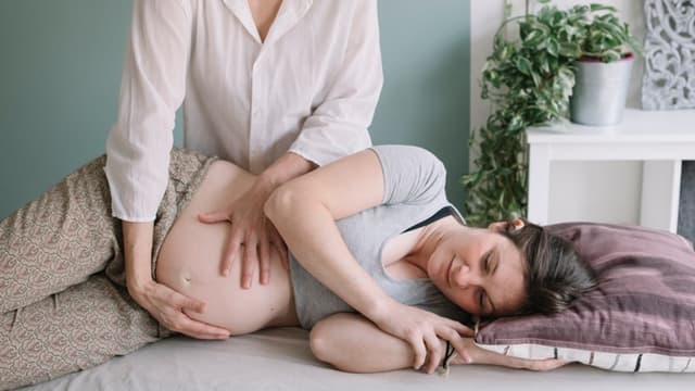 Prenatal massage for relieving discomfort during pregnancy.