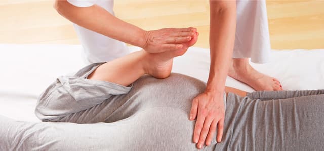 Shiatsu massage focusing on energy points.