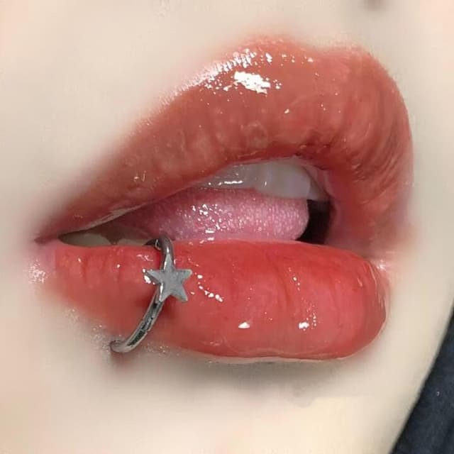 Lip piercings such as labret, Monroe, and snake bites.