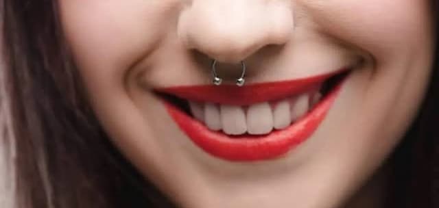 Nose piercings, including nostril and septum.