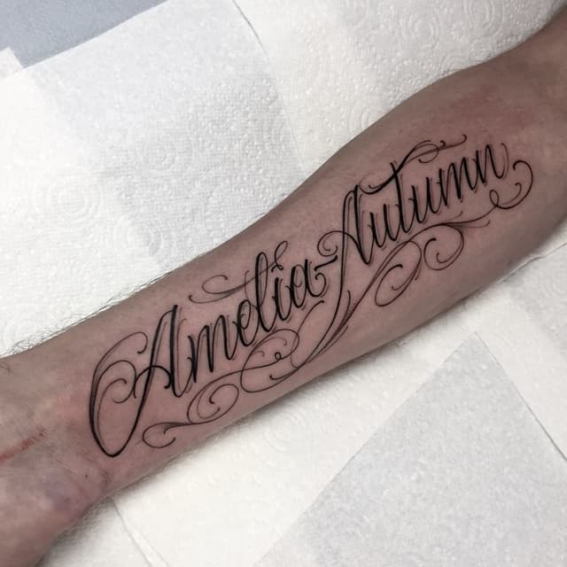 Script tattoos with text, quotes, or names